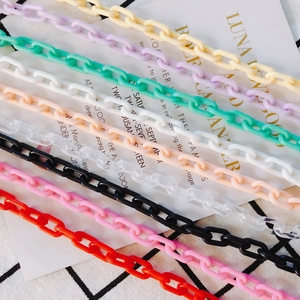 Macro view of colorful acrylic oval link chains for DIY jewelry and bag straps