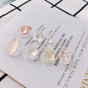 Artistic layout of amber leaf and petal glass beads for DIY jewelry making accessories