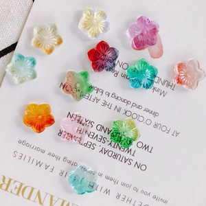 Detailed view of colorful translucent five-petal flower beads for DIY jewelry making