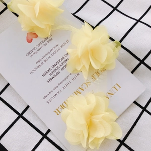 Close-up of light yellow 3D chiffon flower lace trim for DIY clothing and crafts