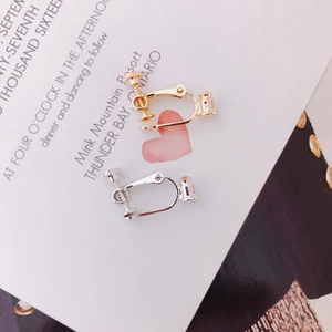 Close-up of adjustable screw earring converters in gold and silver plating