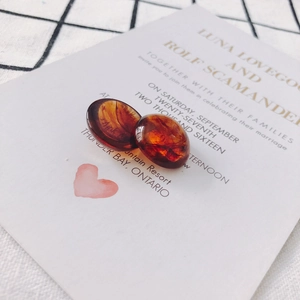 Macro shot of oval amber tortoiseshell acrylic charms for DIY earring and jewelry making