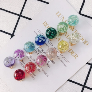 Pastoral clear glass ball pendants with embedded dried flowers and golden loops