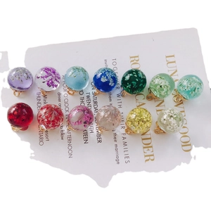 Set of 12 transparent glass sphere charms with colorful dried flowers and gold metal loops