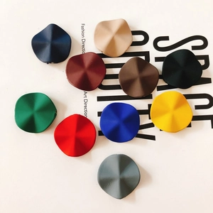Close-up of matte colorful irregular star-shaped resin earring pendants for DIY jewelry