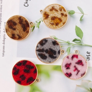 Detailed view of colorful leopard print alloy round pendants with gold metallic edges