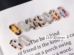 Colorful oval acrylic chain links in marble and floral patterns for DIY jewelry making