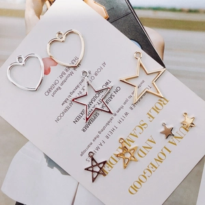Macro shot of assorted heart and star metal frame pendants for DIY jewelry making