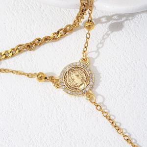 Golden San Benedict medallion necklace with white crystals and multi-layered chain