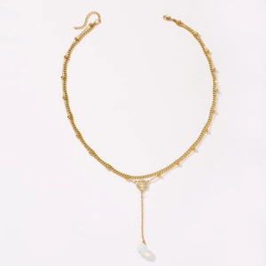 Fashionable gold double-layered necklace with a coin pendant and white bead detail