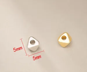 Detail view of 5mm cubic metal beads in gold and silver finish for DIY jewelry