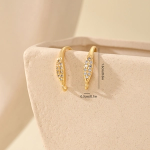 Macro detail of gold-plated earring hooks with micro-pave zircons and 1.6cm size guide