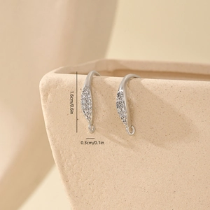 Close-up of silver-plated ear hooks featuring clear cubic zirconia pavé detailing