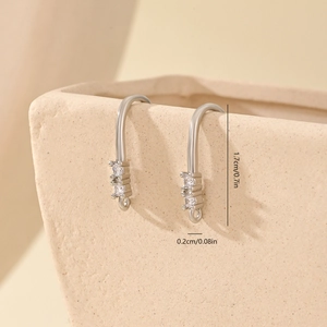Detailed macro view of silver DIY earring hooks with 1.7cm vertical cubic zirconia stones