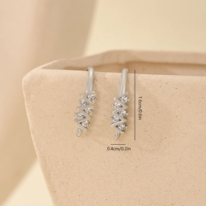 Detail of silver zigzag ear hooks with four inlaid cubic zirconia and size markings