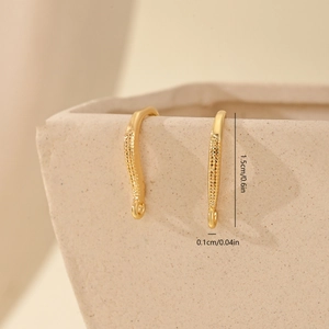 Macro view of 1.5cm gold-plated zircon earring hooks with grain texture and dimensions