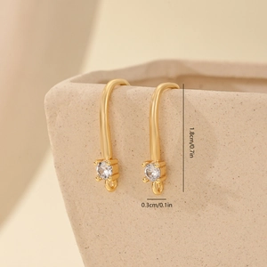 Detail of gold earring hooks with cubic zirconia and dimensions 1.8cm by 0.3cm
