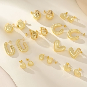 Gold-plated geometric earrings set featuring heart, teardrop, and spiral designs