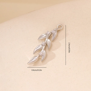Macro shot of leaf branch pendant with 2.4cm height and zircon inlay for DIY jewelry