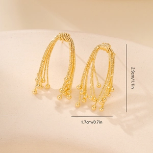 Detailed view of gold bow earrings showing 2.9cm height and 1.7cm width dimensions