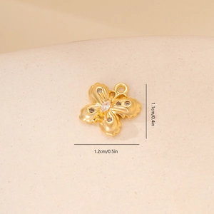 Detail view of a 1.2cm gold butterfly pendant with zircon inlay and size dimensions