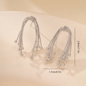 Macro shot showing dimensions of silver textured bow stud earrings in 2.9cm height