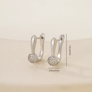 Detail view showing 1.6cm drop earrings with cubic zirconia inlay and silver finish