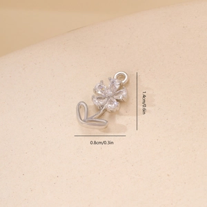 Macro detail of zircon flower pendant showing 1.4cm height and 0.8cm width dimensions