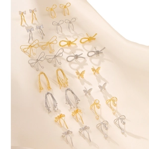 Elegant gold and silver geometric bow earrings collection with zircon details