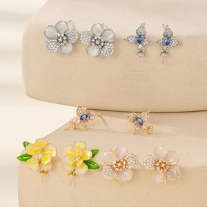 Luxurious gold-plated floral earrings with sparkling cubic zirconia and enamel petals