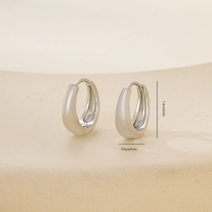 Polished silver U-shaped hoop earring details with size markings 1.4cm by 0.5cm