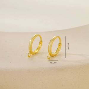 Macro detail of 1.6cm golden earring hoop accessory with small loop for DIY jewelry making