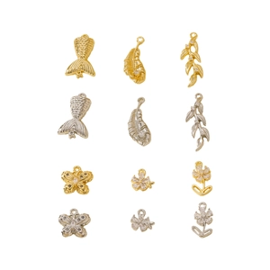 DIY jewelry making supplies featuring gold and silver zircon pendants in geometric shapes