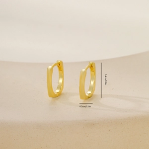 Detail view of gold rectangular earring hoops with 1.4cm height and matte texture