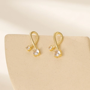 Golden geometric twisted leaf stud earrings featuring brilliant round-cut cubic zirconia