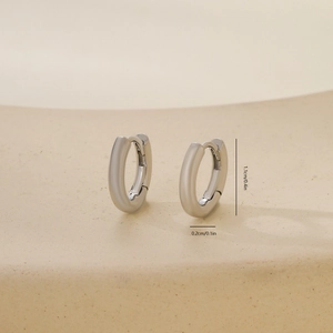 Detailed view of silver hoop earrings showing dimensions 1.1cm height and 0.2cm width