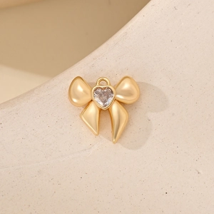 Colgante de lazo con circón de corazón para joyas DIY con acabado dorado mate