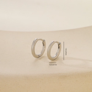 Close-up of high-polished silver round hoop earrings with 1.5cm diameter dimensions