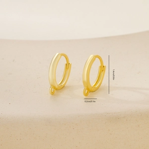Detailed view of polished gold hoop earring component with 1.4cm diameter and 0.2cm DIY loop