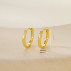 Close-up of golden round hoop earrings with size dimensions 1cm height and 0.2cm width