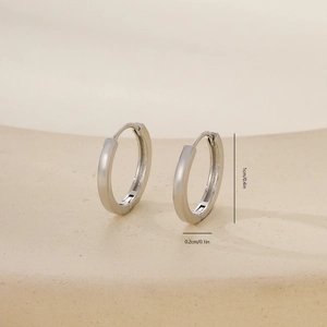 Detailed view of polished silver hoop earrings with 1cm outer diameter measurements