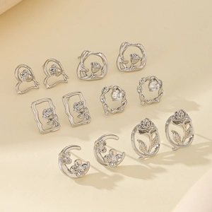 Set of six silver floral earrings featuring rose designs and sparkling zircon accents