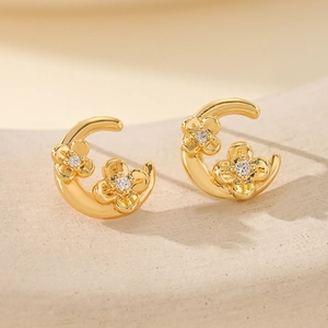 Elegant gold flower crescent moon stud earrings with white zircon stone accents