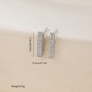Detail shot of zircon geometric earrings showing dimensions 1.4cm height and 0.3cm width