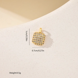 Detailed view of a gold square zircon pendant showing 1cm by 0.7cm product dimensions