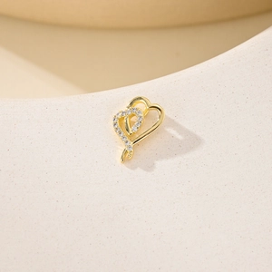 Gold interlocking heart pendant with white zircon stones for jewelry making
