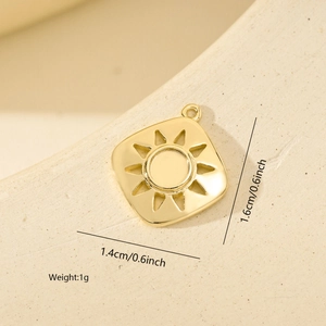 Detailed macro view of a gold square sun pendant showing exact 1.6cm by 1.4cm dimensions