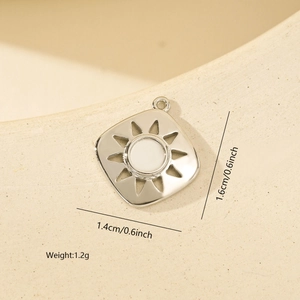 Detail of square sunburst metal pendant with zircon inlay for DIY jewelry design