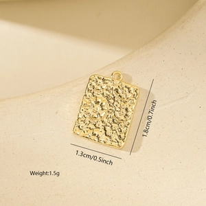 Detailed size view of a gold floral rectangle pendant with 1.8cm length and 1.3cm width