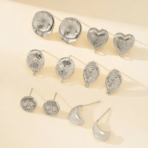 Assorted silver geometric earrings set with relief carvings and brushed metal textures
